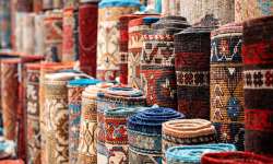 View of multiple carpets for sale at the Grand Bazaar in Istanbul, Turkey